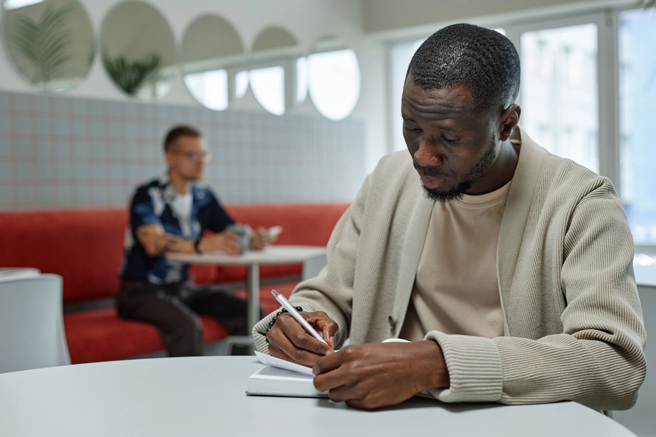 Sports writer working at a desk taking notes